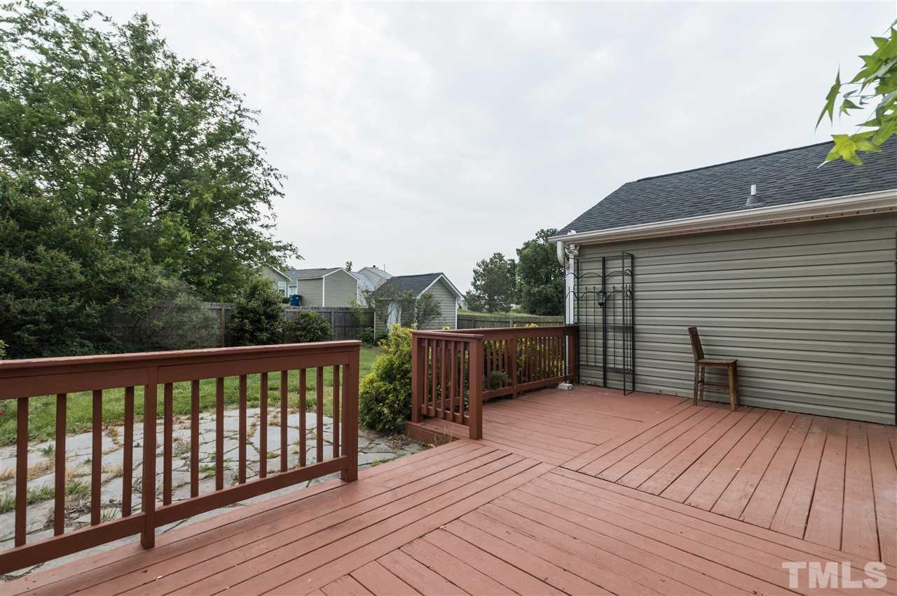 5008 Silverdene Street Raleigh, NC 27616 - Photo 20 of 23 a balcony with wooden floor and fence