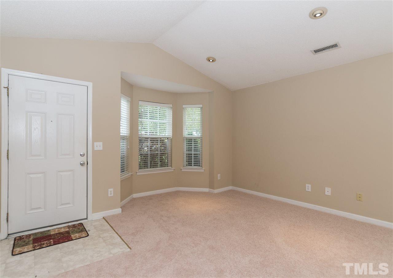 5008 Silverdene Street Raleigh, NC 27616 - Photo 3 of 23 an empty room with windows