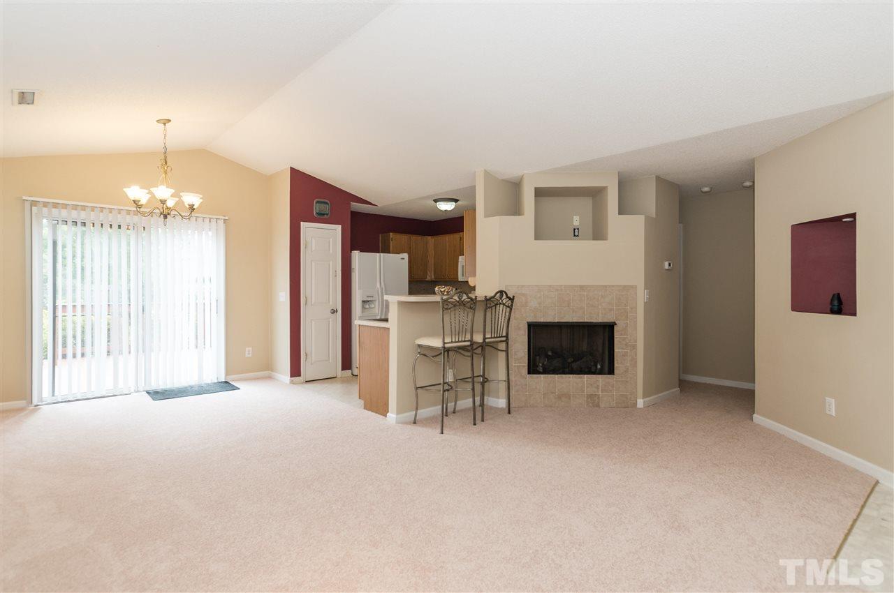 5008 Silverdene Street Raleigh, NC 27616 - Photo 5 of 23 a view of a livingroom with furniture and a fireplace