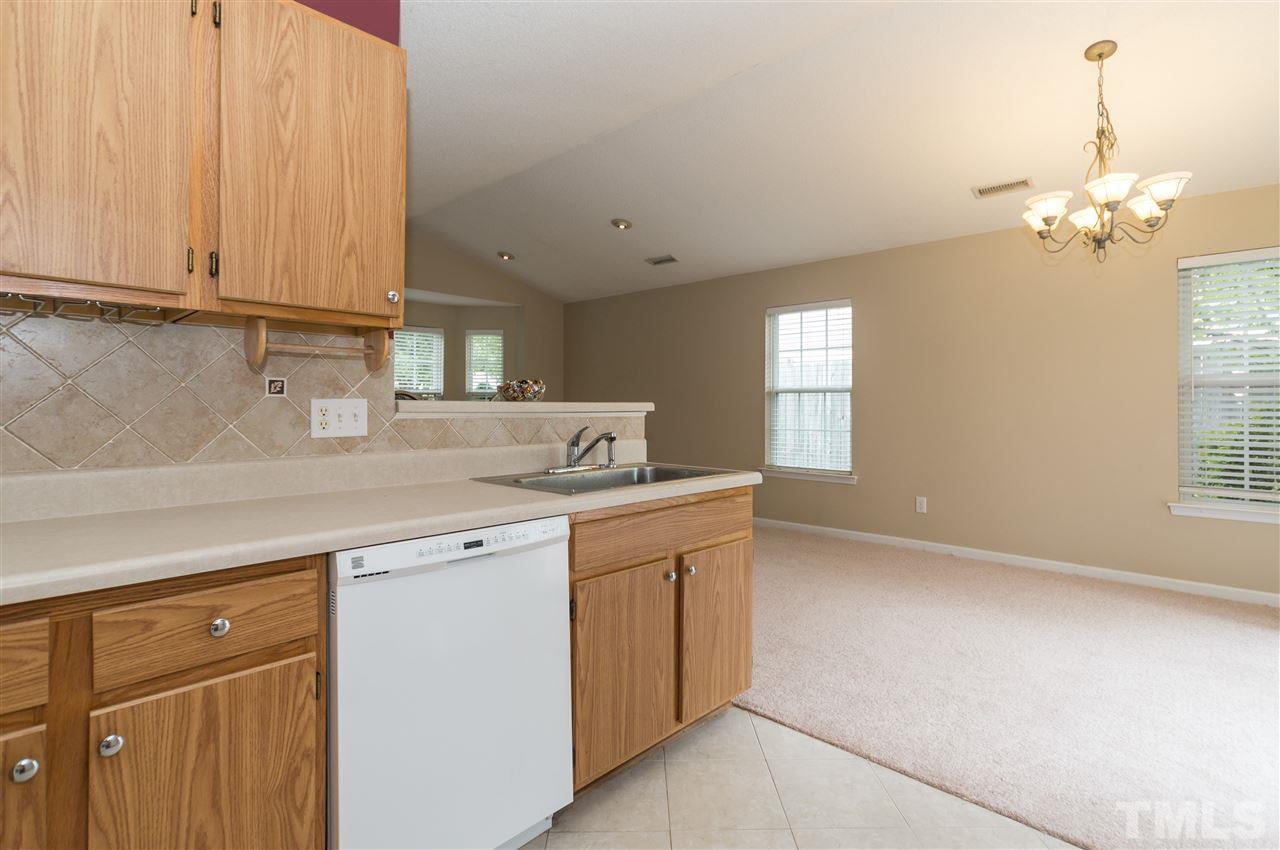 5008 Silverdene Street Raleigh, NC 27616 - Photo 8 of 23 a kitchen with cabinets appliances and a window