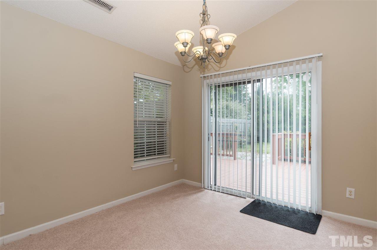 5008 Silverdene Street Raleigh, NC 27616 - Photo 9 of 23 a view of a livingroom with a chandelier