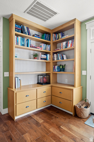 236 West 300 South Hurricane, UT 84737 - Photo 17 of 76 Corner built-in shelving unit with beadboard backing, integrated drawers, and wood-finish flooring