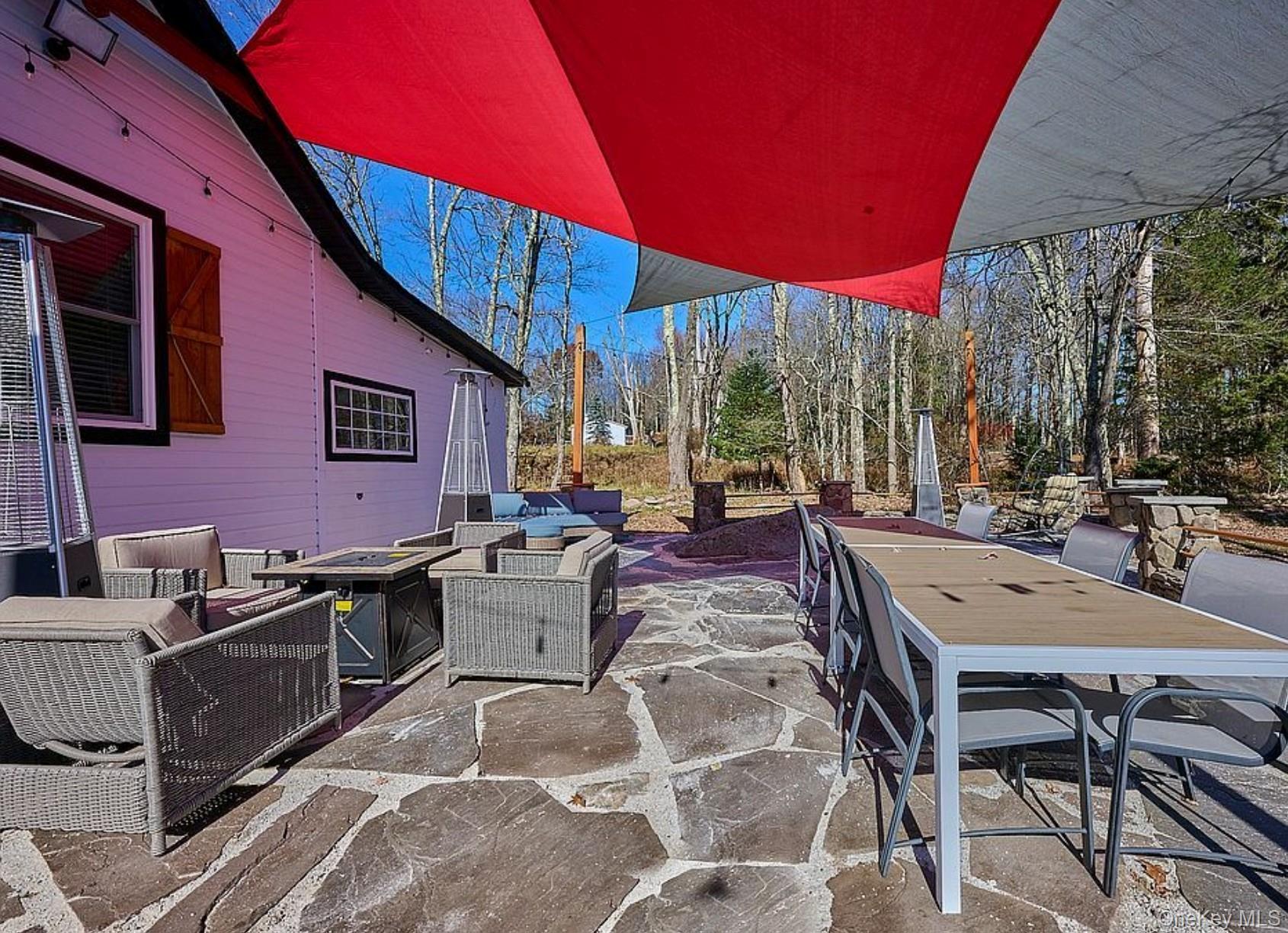 541 Cold Spring Road Monticello, NY 12701 - Photo 25 of 31 a view of a patio with swimming pool table and chairs