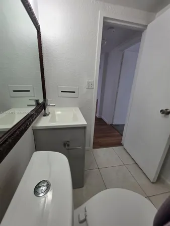 a bathroom with a toilet and a sink