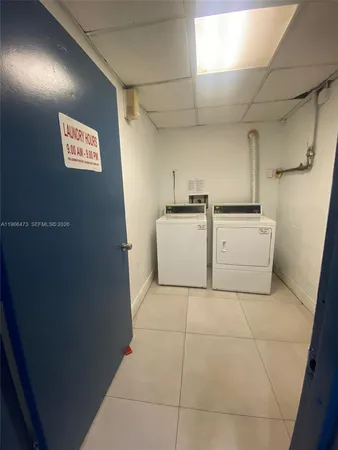 a kitchen with a cabinets and white appliances