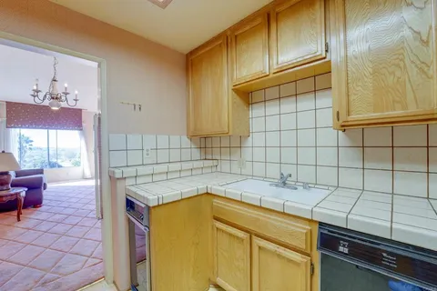 a bathroom with a sink and a washing machine
