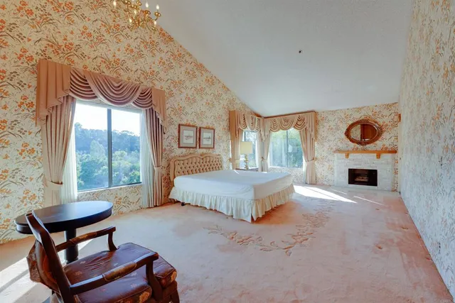 a spacious bedroom with a bed and window