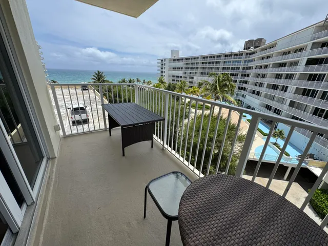 a view of balcony with furniture