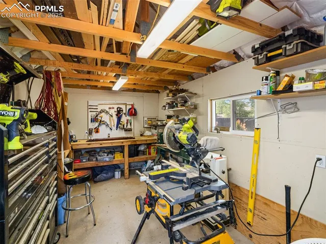 an aerial view of a house with garden space and street view