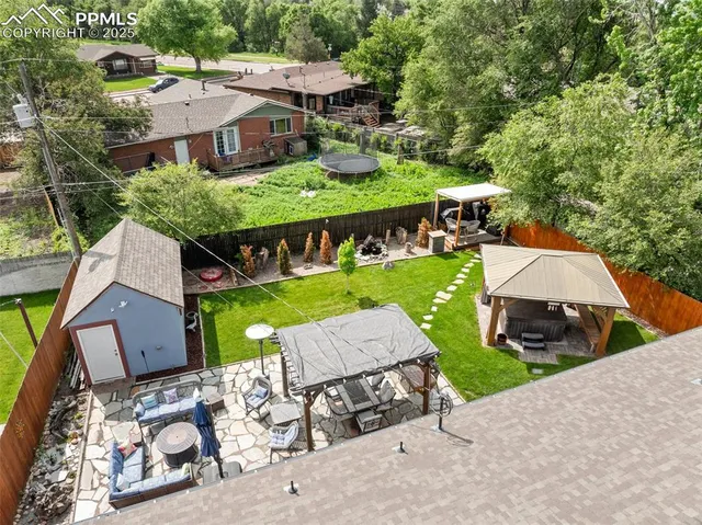 an aerial view of a house with a garden and plants