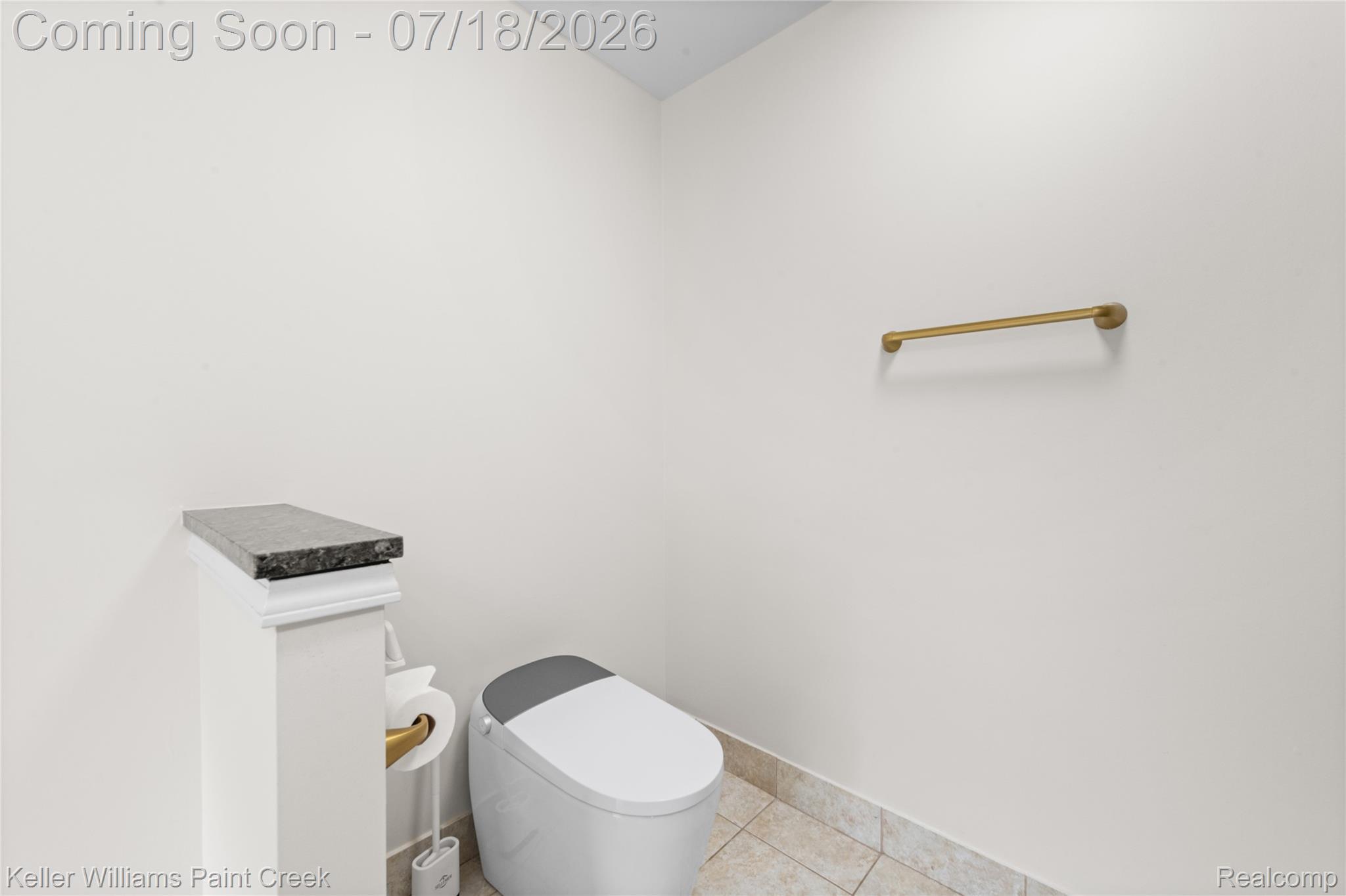4230 Holly Lane Rochester, MI 48306 - Photo 33 of 64 Powder room featuring a modern toilet, granite-topped pedestal, and tiled flooring