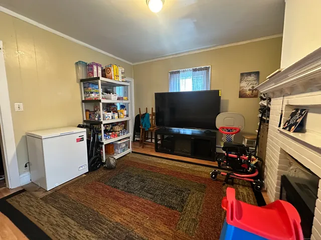 a room with furniture and a flat screen tv