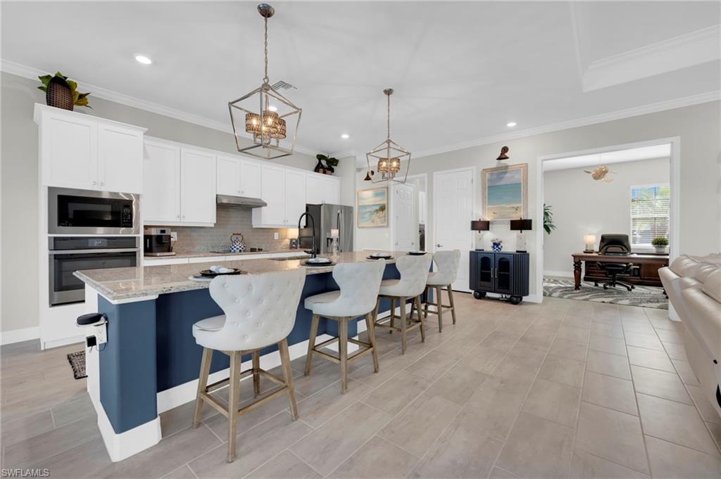 17852 Rosehill Court Estero, FL 33928 - Photo 7 of 50 Elegant Chandeliers throughout, all on dimmers