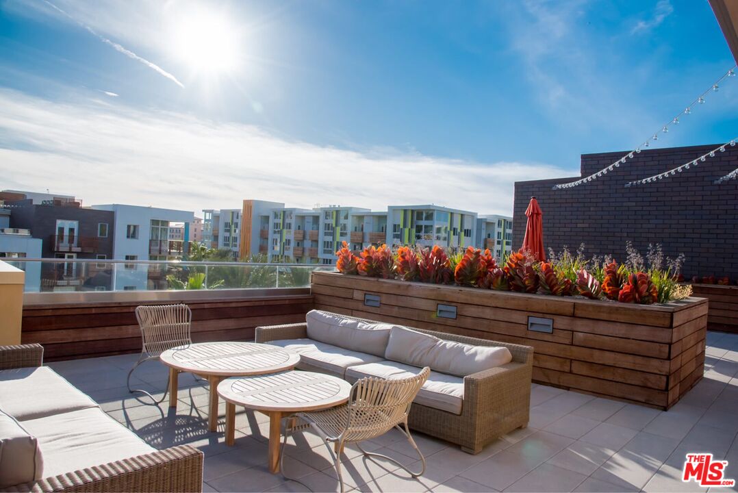 12760 Millennium Drive, Unit NA209 Los Angeles, CA 90094 - Photo 14 of 39 a outdoor living space with patio furniture and a potted plant