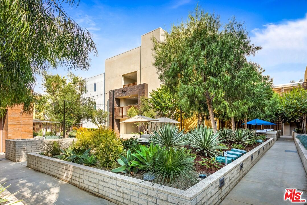 12760 Millennium Drive, Unit NA209 Los Angeles, CA 90094 - Photo 34 of 39 a street view with tall buildings
