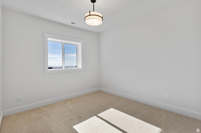 710 East Mountain Road North Ogden, UT 84414 - Photo 31 of 36 Neutral tone walls and carpeting create a versatile interior