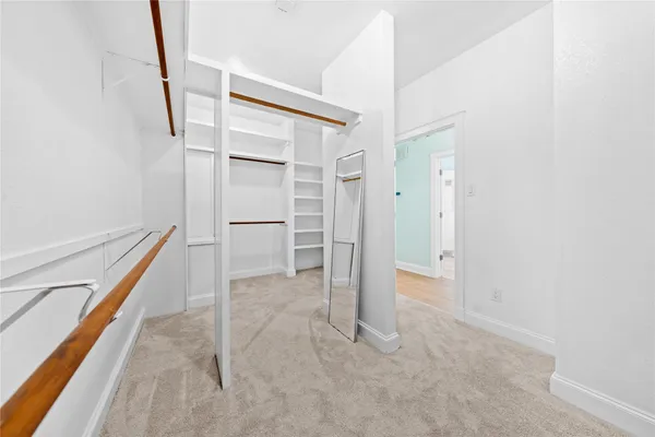 a en suite bathroom with a granite countertop tub and a large window