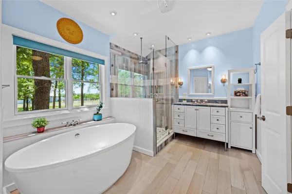 a living room with furniture a floor to ceiling windows and a table