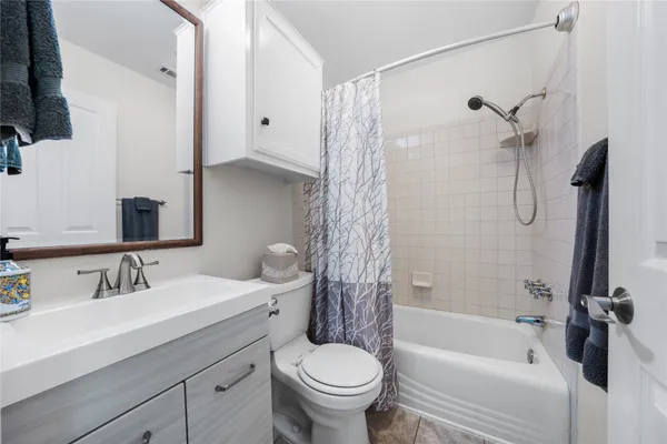 a living room with a bed furniture and a window