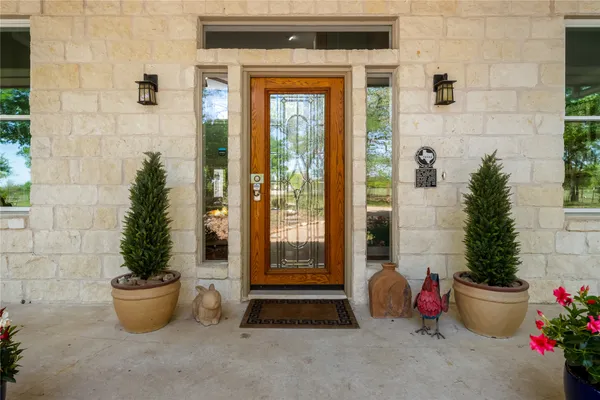 a bathroom with a potted plant and potted plants