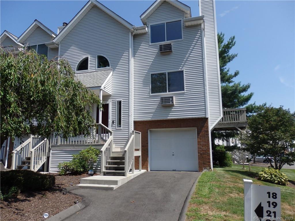 925 Oronoke Road, Unit 25H Waterbury, CT 06708 - Photo 1 of 1 a front view of a house with a yard