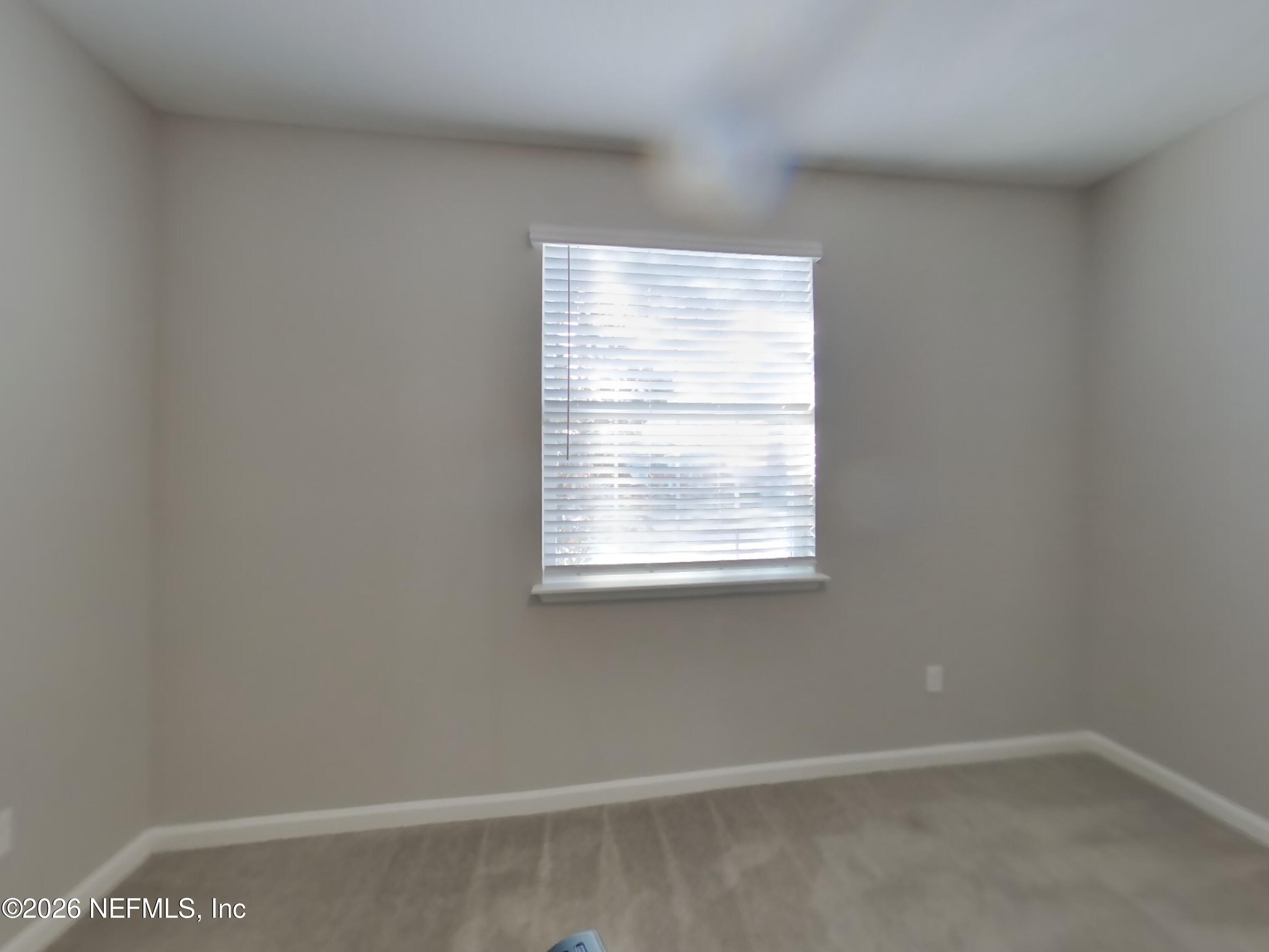 155 Bloomfield Way St. Augustine, FL 32092 - Photo 11 of 15 a view of an empty room with a window