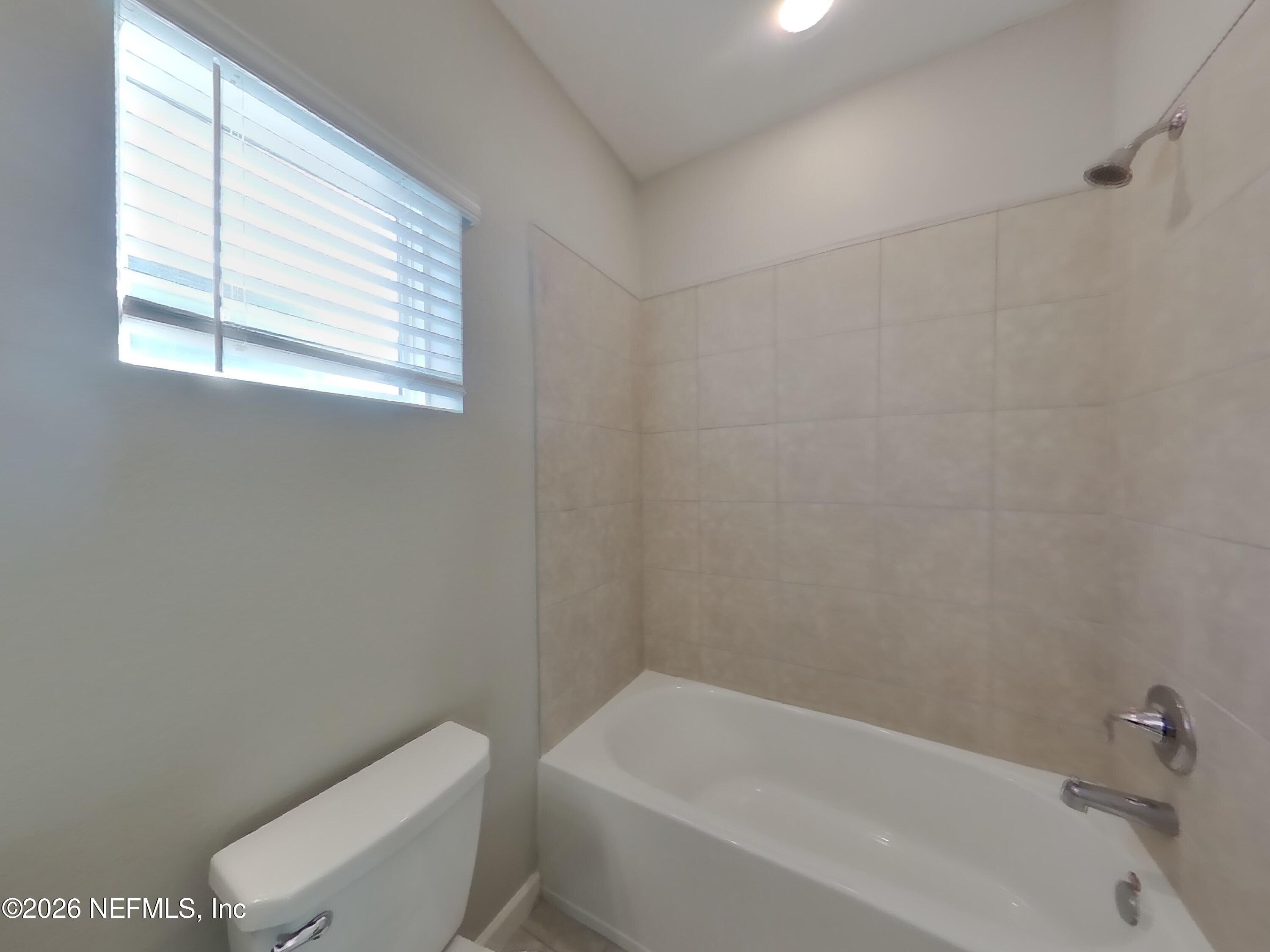 155 Bloomfield Way St. Augustine, FL 32092 - Photo 13 of 15 a white bath tub sitting next to a white toilet