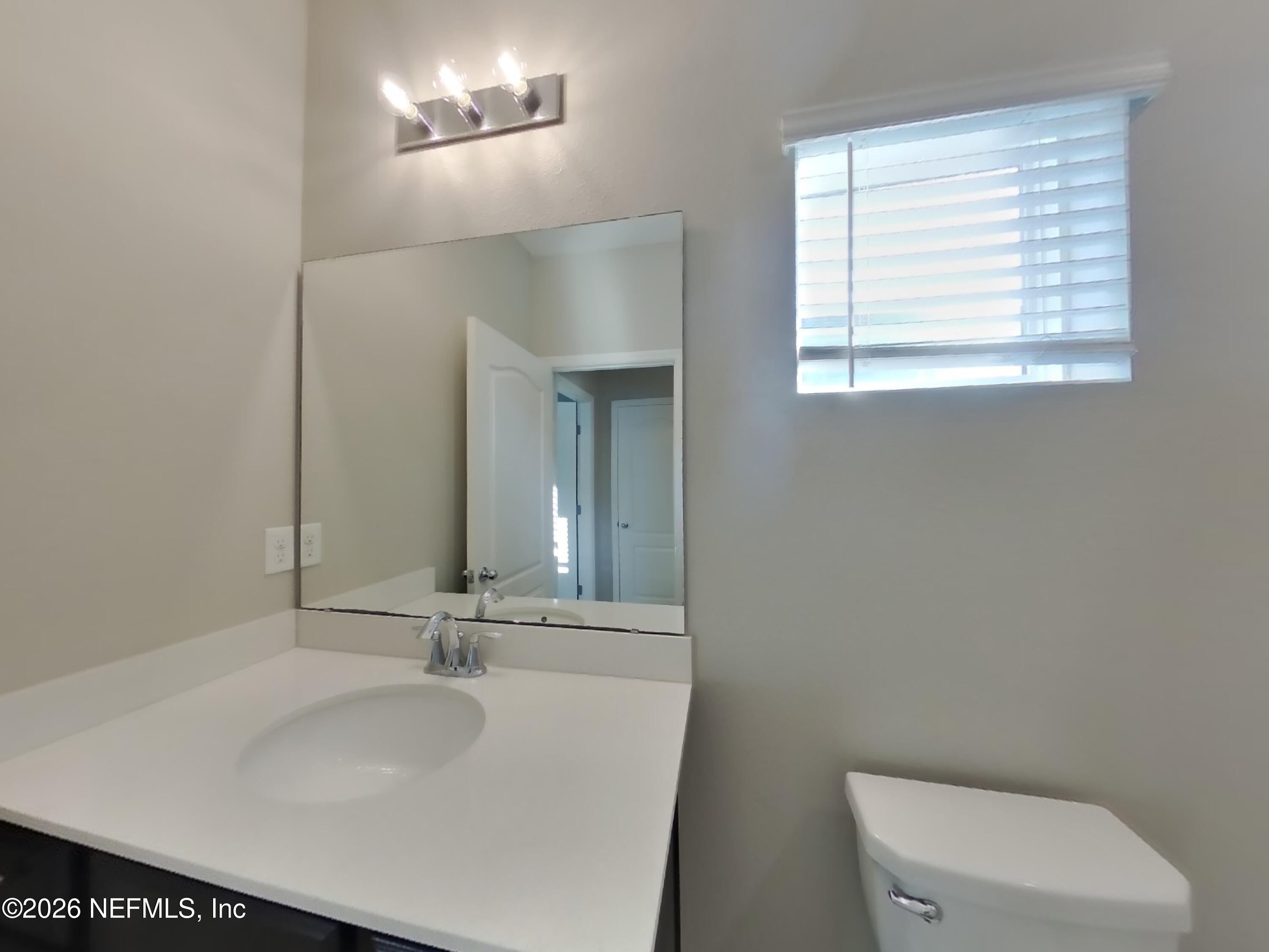 155 Bloomfield Way St. Augustine, FL 32092 - Photo 14 of 15 a bathroom with a sink and a toilet