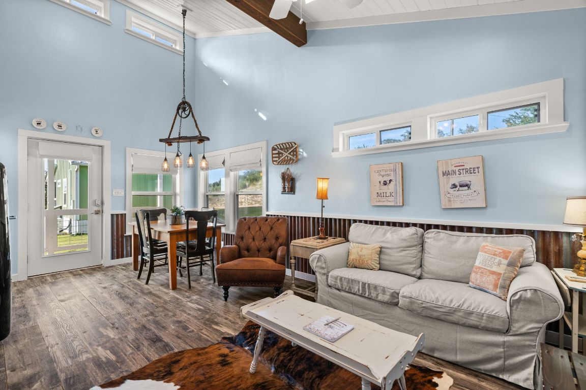 365 Billy Sisson Road Johnson City, TX 78636 - Photo 13 of 40 a living room with furniture kitchen view and a chandelier