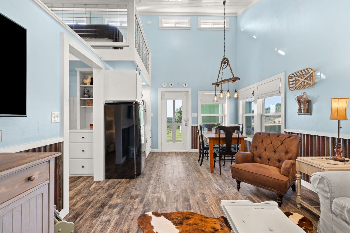 365 Billy Sisson Road Johnson City, TX 78636 - Photo 15 of 40 a living room with furniture and a flat screen tv