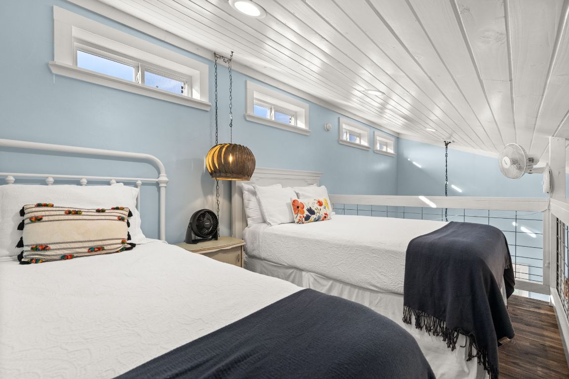 365 Billy Sisson Road Johnson City, TX 78636 - Photo 21 of 40 a bedroom with a bed and window