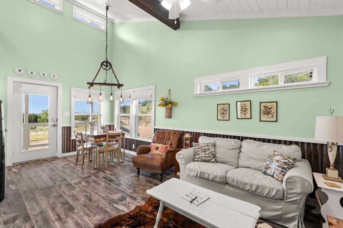 365 Billy Sisson Road Johnson City, TX 78636 - Photo 27 of 40 a living room with furniture and a chandelier