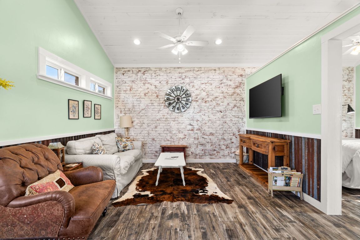 365 Billy Sisson Road Johnson City, TX 78636 - Photo 29 of 40 a living room with furniture and a flat screen tv
