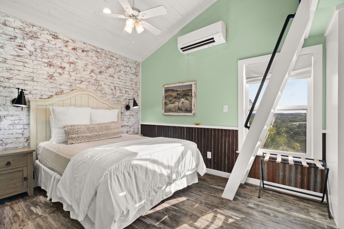 365 Billy Sisson Road Johnson City, TX 78636 - Photo 30 of 40 a bedroom with a bed and a window