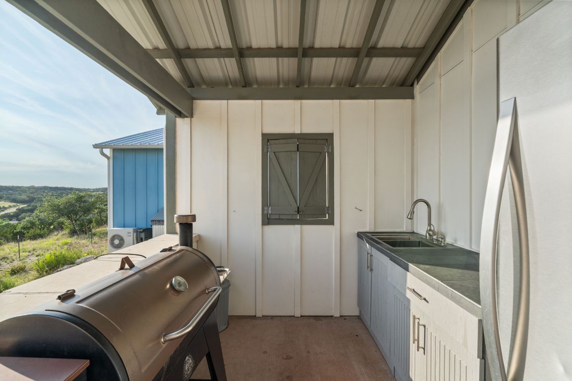 365 Billy Sisson Road Johnson City, TX 78636 - Photo 31 of 40 a room with a bed and a dresser