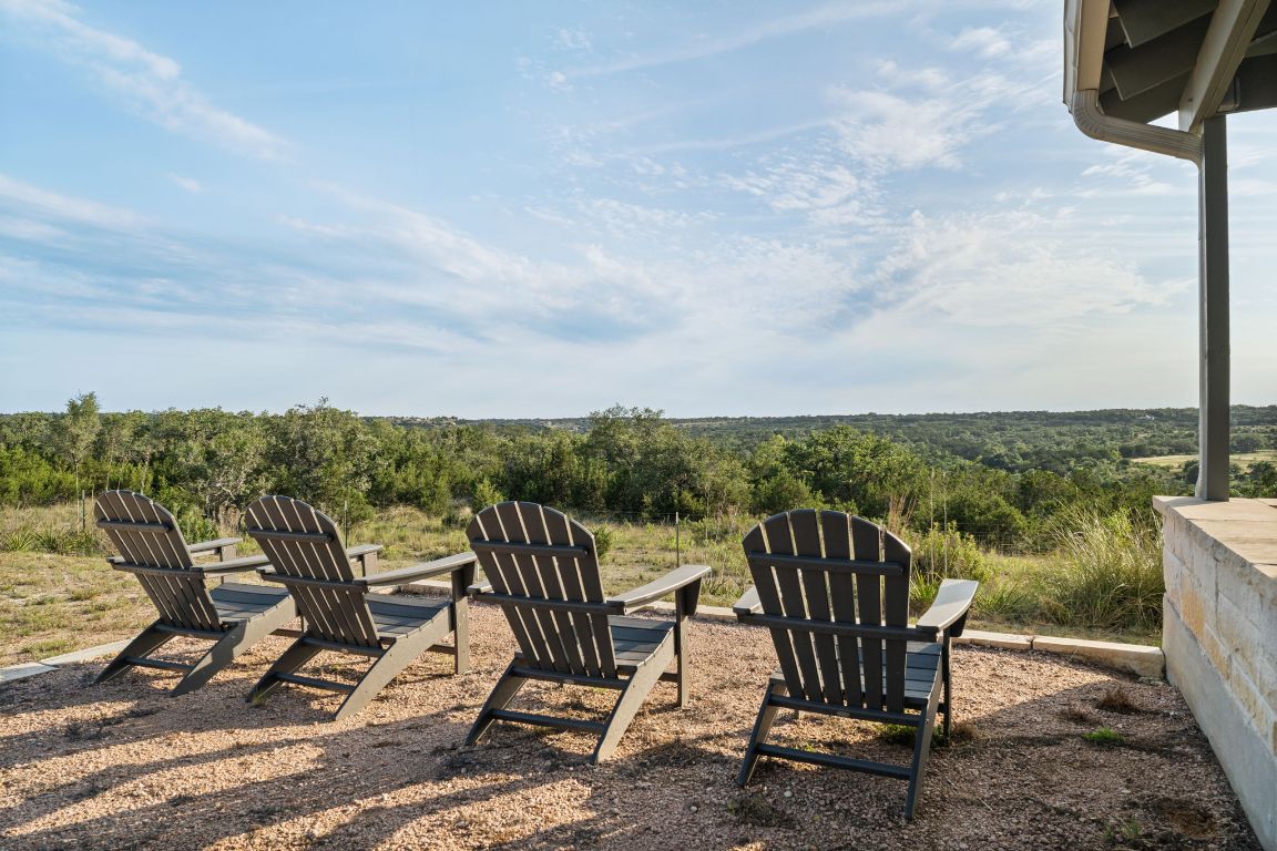 365 Billy Sisson Road Johnson City, TX 78636 - Photo 7 of 40 a view of a chairs and table on the terrace