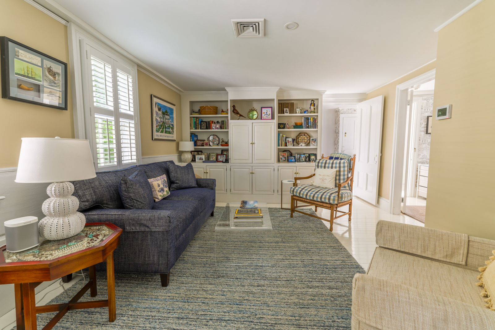 12 Hussey Street Nantucket, MA 02554 - Photo 22 of 47 a living room with furniture and a table