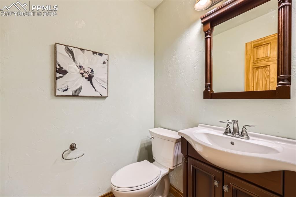 151 Star View Circle Palmer Lake, CO 80133 - Photo 14 of 36 Bathroom with toilet and vanity