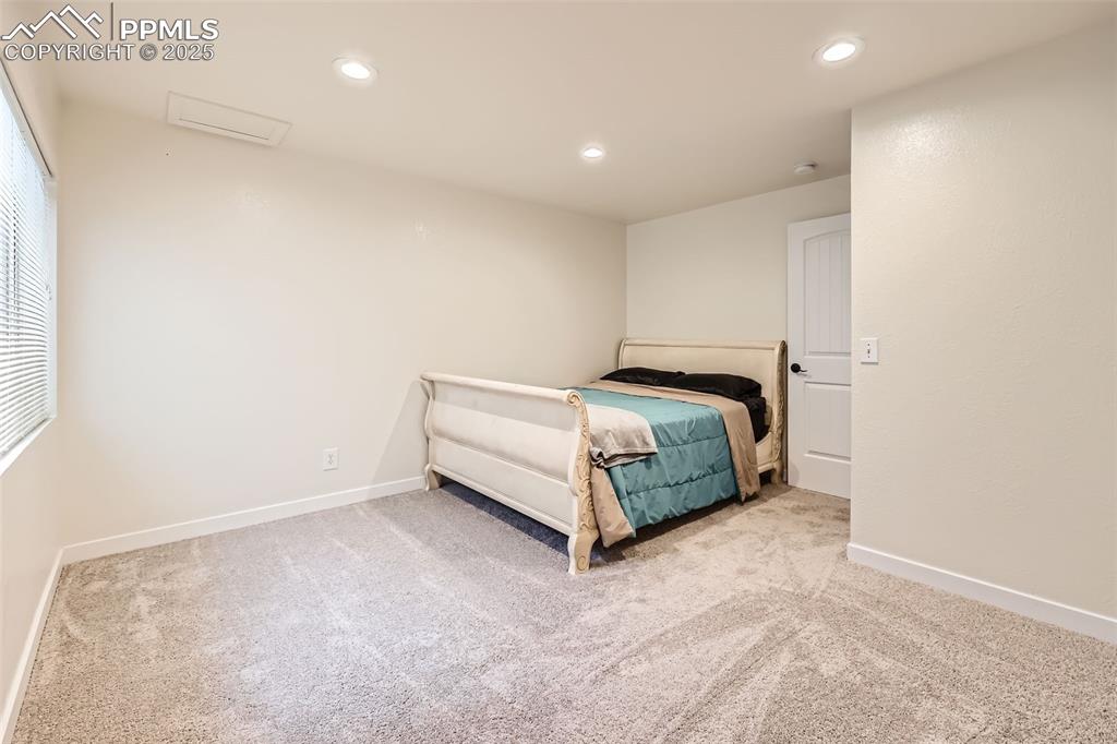 151 Star View Circle Palmer Lake, CO 80133 - Photo 25 of 36 Carpeted bedroom with baseboards and recessed lighting