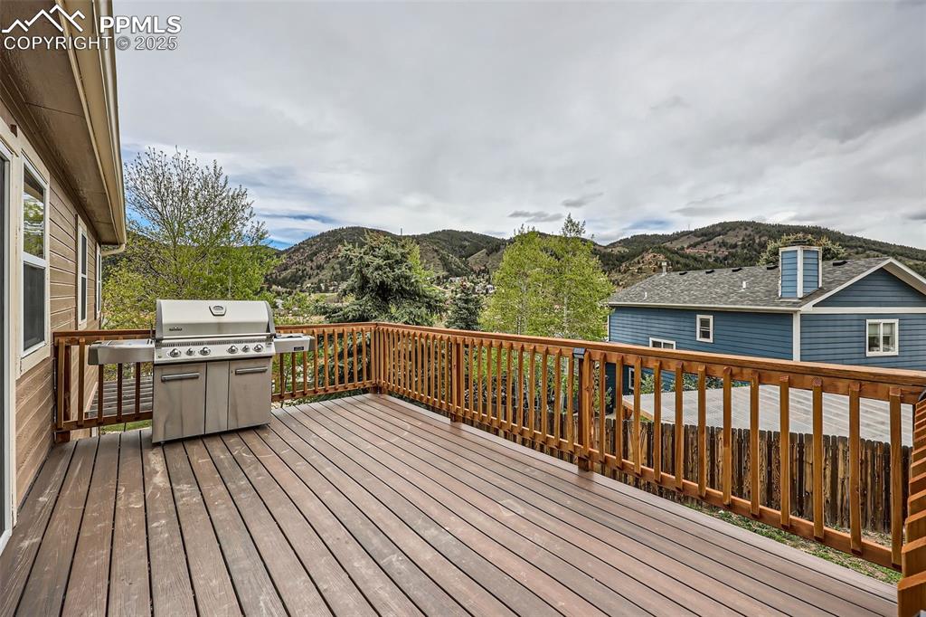 151 Star View Circle Palmer Lake, CO 80133 - Photo 28 of 36 Deck with area for grilling and a mountain view