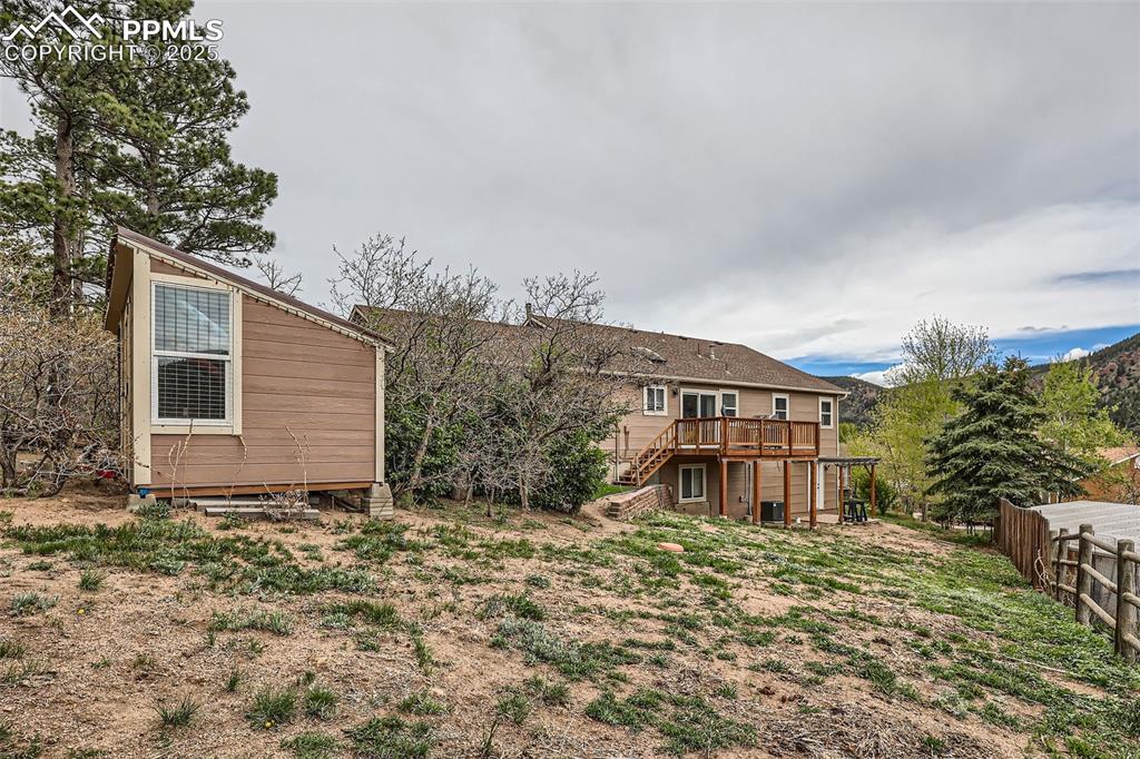 151 Star View Circle Palmer Lake, CO 80133 - Photo 29 of 36 Back of property with stairs and a deck