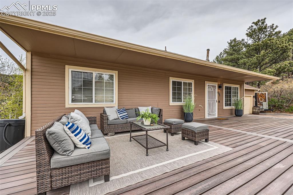 151 Star View Circle Palmer Lake, CO 80133 - Photo 3 of 36 Wooden deck with an outdoor living space