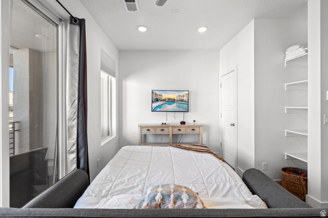 1122 South 1790th Street West, Unit 2 St. George, UT 84770 - Photo 15 of 37 Room featuring a sliding glass door to an exterior balcony, a single window with blinds, and recessed lighting