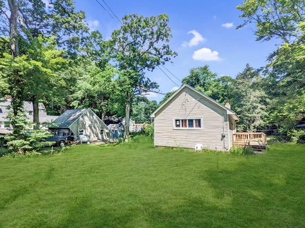 36 Pine Road Charlton, MA 01507 - Photo 3 of 9 a view of a house with a yard and a garden