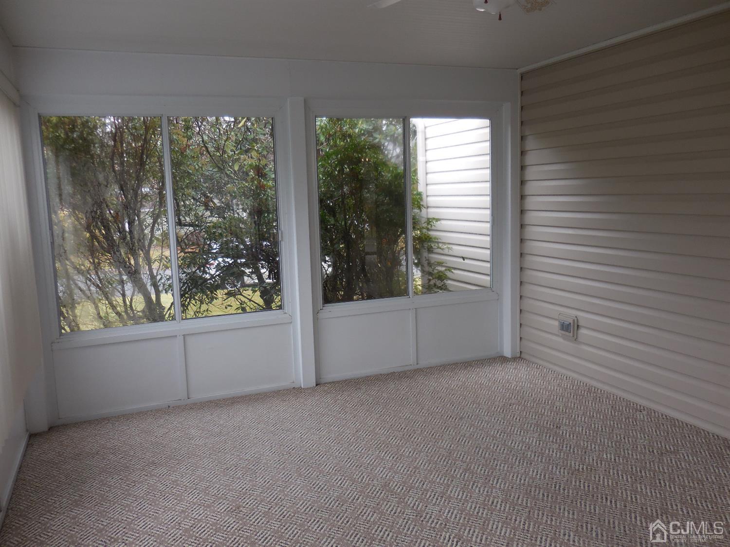 276 Carber Street Bound Brook, NJ 08805 - Photo 12 of 36 an empty room with windows