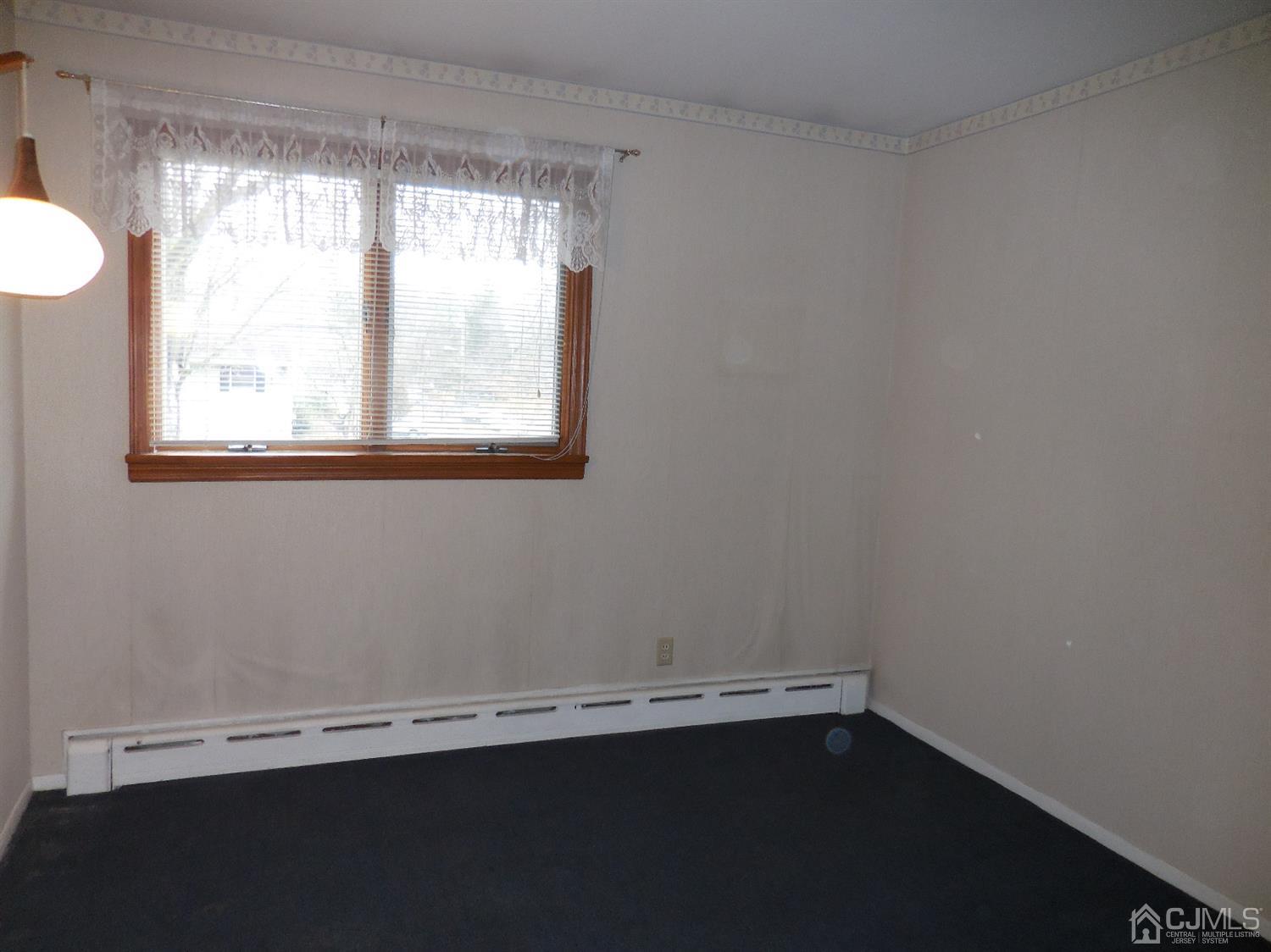 276 Carber Street Bound Brook, NJ 08805 - Photo 14 of 36 an empty room with a window