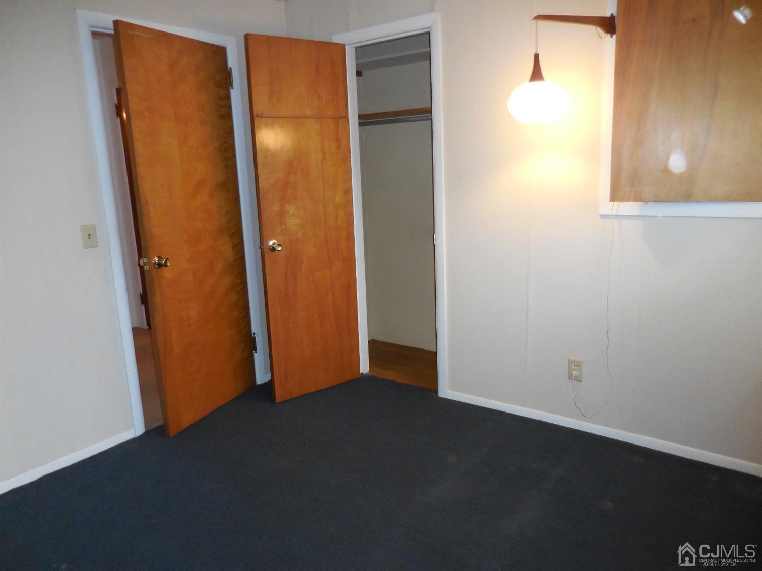 276 Carber Street Bound Brook, NJ 08805 - Photo 16 of 36 an empty room with a door