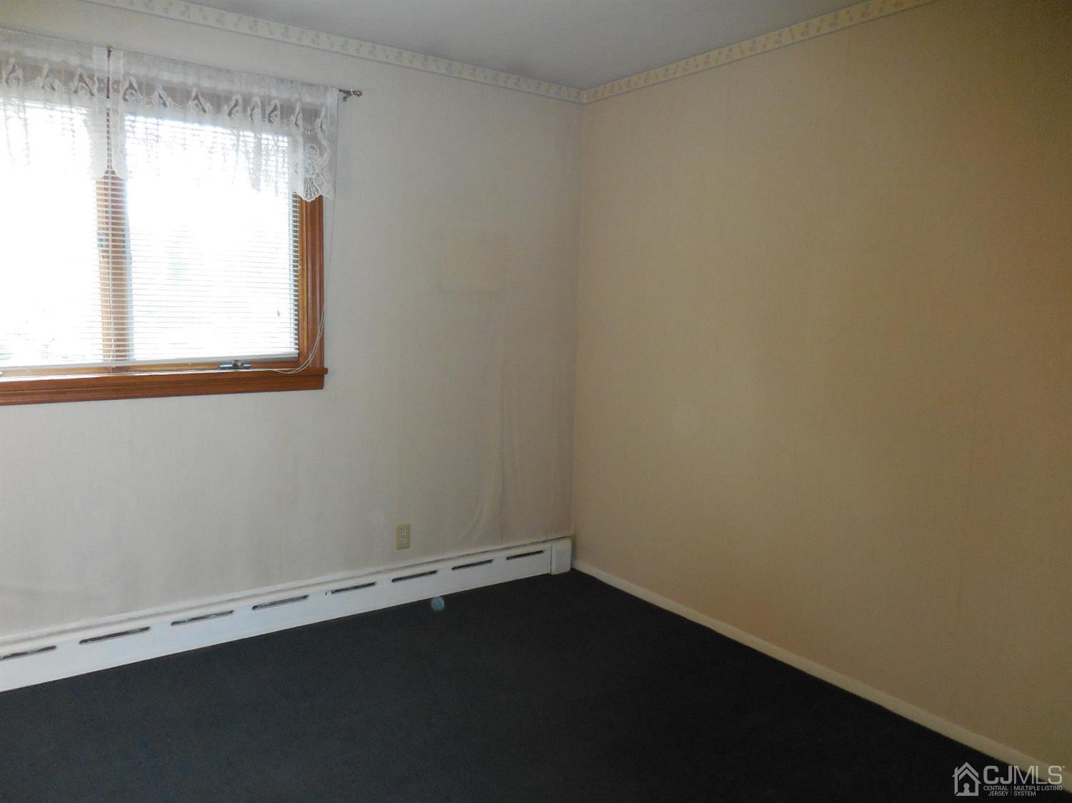 276 Carber Street Bound Brook, NJ 08805 - Photo 17 of 36 an empty room with a window