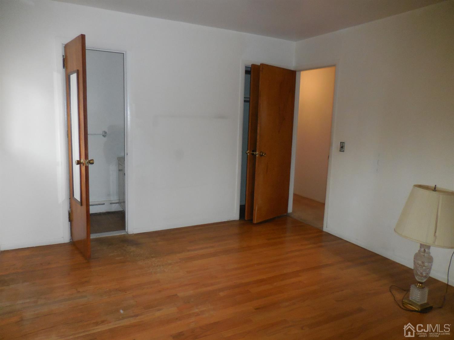 276 Carber Street Bound Brook, NJ 08805 - Photo 19 of 36 a view of an empty room with wooden floor and closet
