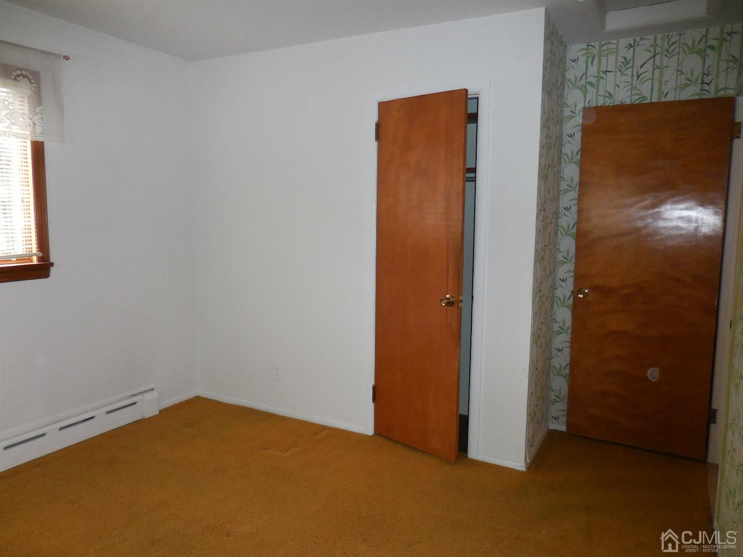 276 Carber Street Bound Brook, NJ 08805 - Photo 23 of 36 an empty room with windows and closet
